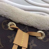 Back view of modern signature women's handbag – women's luxury accessory