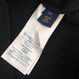 Side profile of Louis Vuitton luxury clothing with signature branding