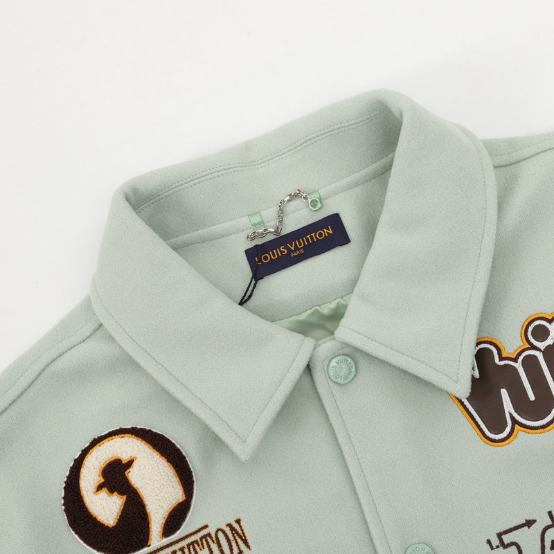 Close-up detail shot of Louis Vuitton luxury clothing with logo-detail design