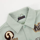 Close-up detail shot of Louis Vuitton luxury clothing with logo-detail design