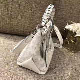 Close-up detail of classic refined women's handbag – women's luxury handbag