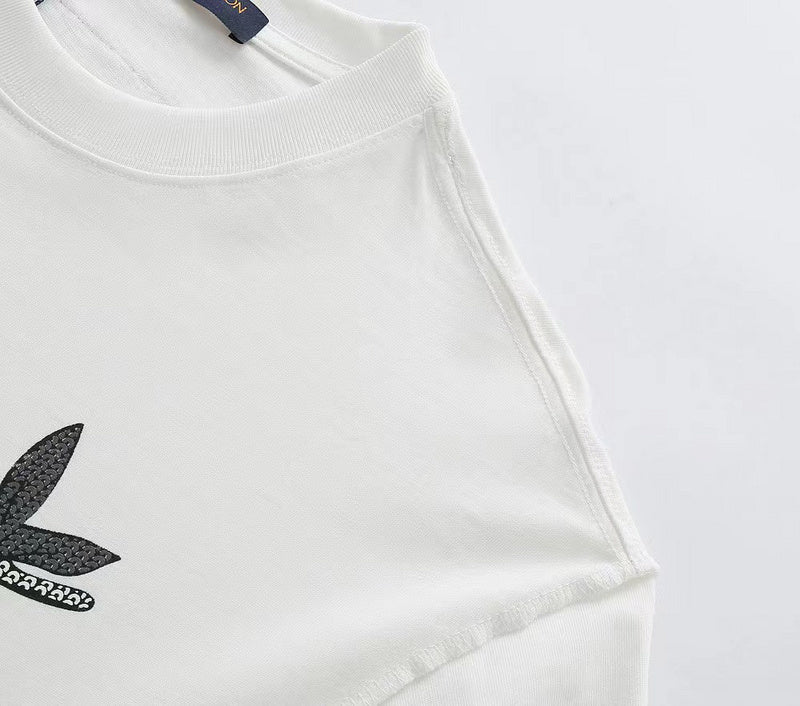 Flat lay presentation of Louis Vuitton cotton t-shirt with monogram-inspired silhouette