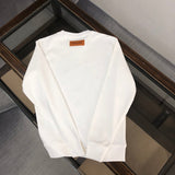 Close-up detail shot of Louis Vuitton luxury clothing with relaxed-fit cut