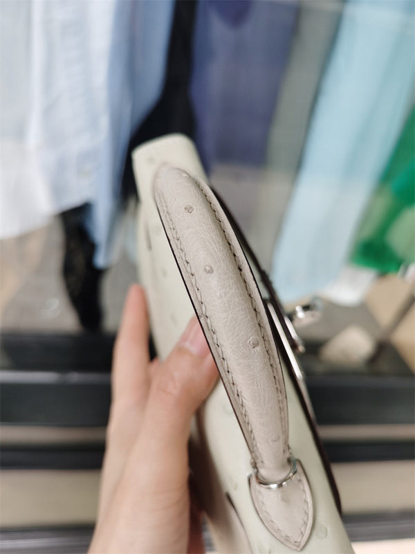  Elegant top-handle bag carried on shoulder
