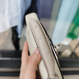  Elegant top-handle bag carried on shoulder