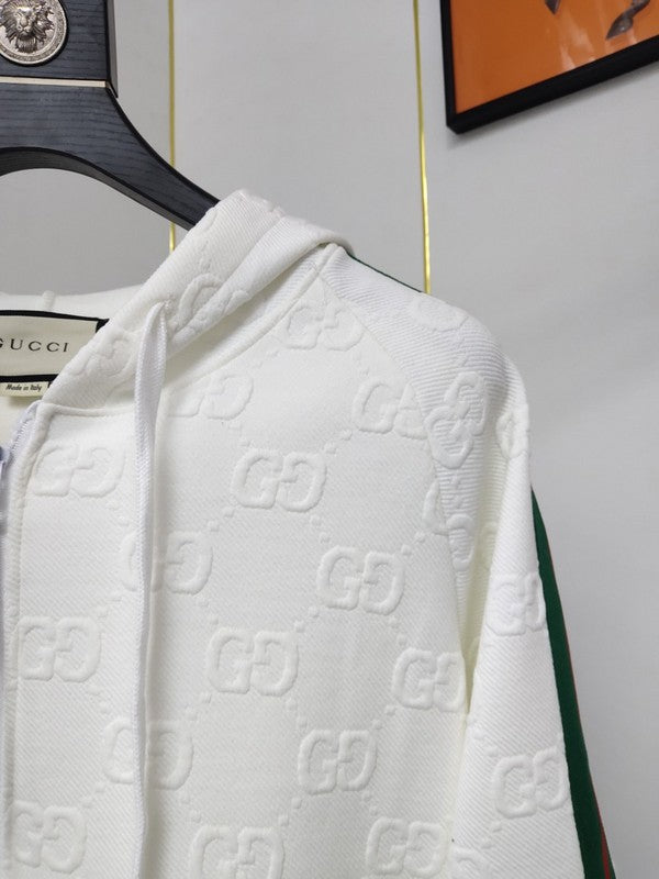 Close-up detail shot of Gucci luxury clothing with label-forward styling