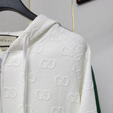 Close-up detail shot of Gucci luxury clothing with label-forward styling