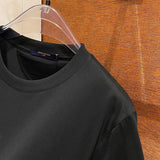 Flat lay presentation of Louis Vuitton cotton t-shirt with tailored silhouette
