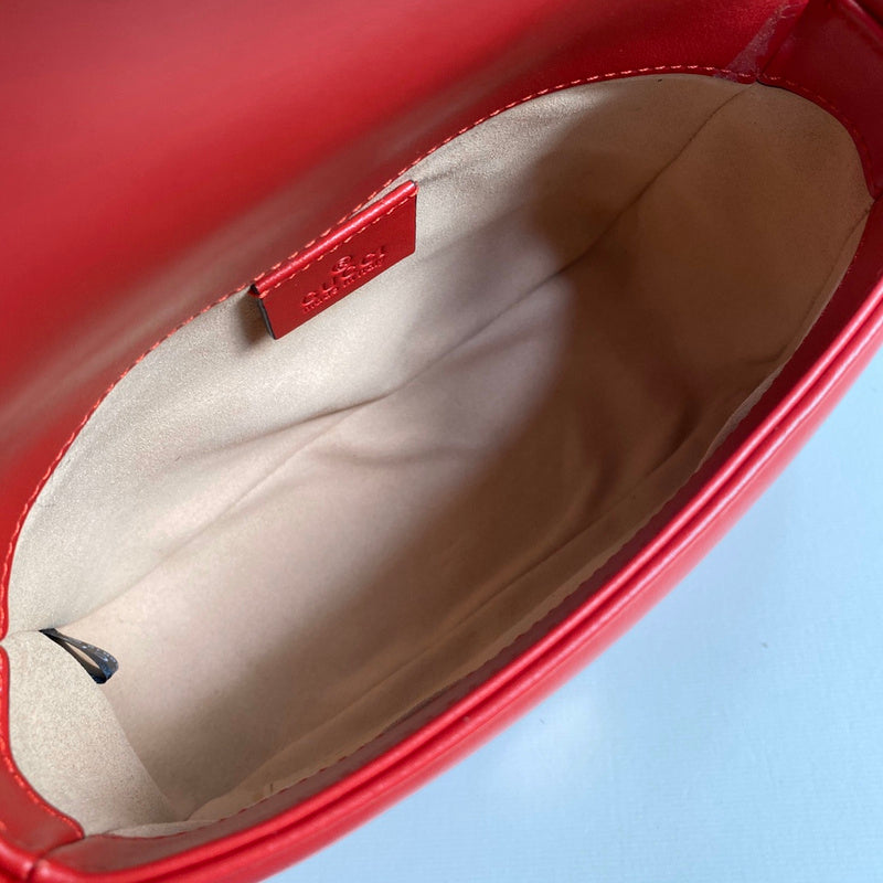 Side profile of signature chic women's handbag – women's designer-style accessory