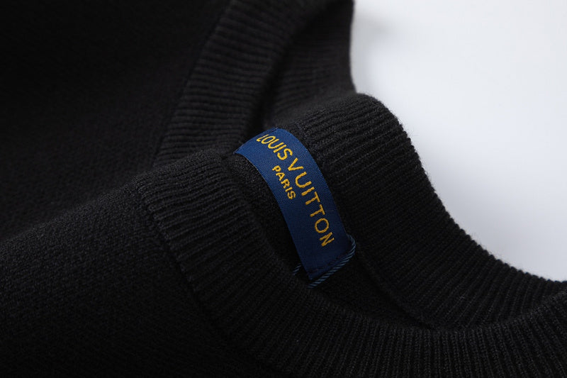 Side profile of Louis Vuitton luxury clothing with label-forward styling