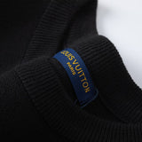 Side profile of Louis Vuitton luxury clothing with label-forward styling