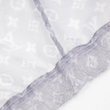 Close-up detail shot of Louis Vuitton luxury clothing with monogram-inspired silhouette