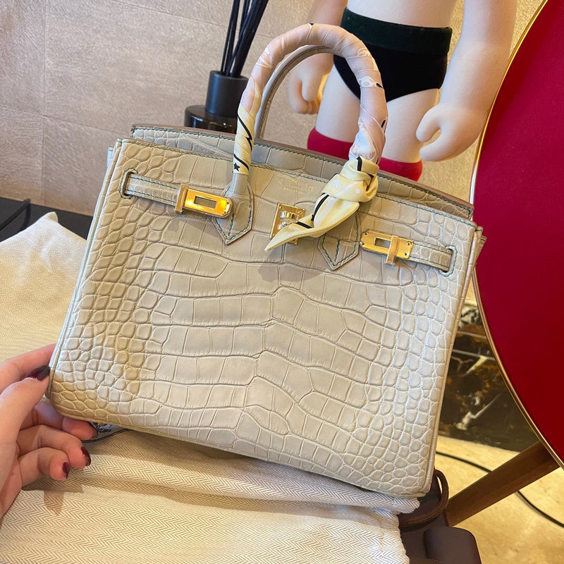Side view of streamlined structured handbag