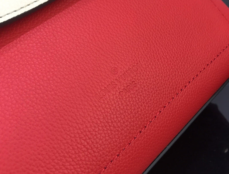 Handle and strap detail of polished refined women's handbag – women's statement bag