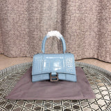 Close-up detail of structured polished women's handbag – women's designer-style accessory