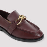 Close-up of Bottega Veneta slides hardware and fine stitching