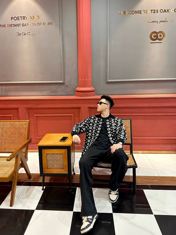 Flat lay presentation of Louis Vuitton luxury clothing with runway-inspired design