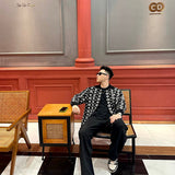 Flat lay presentation of Louis Vuitton luxury clothing with runway-inspired design
