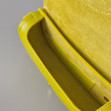 Side profile of statement sleek women's handbag – women's designer-style accessory