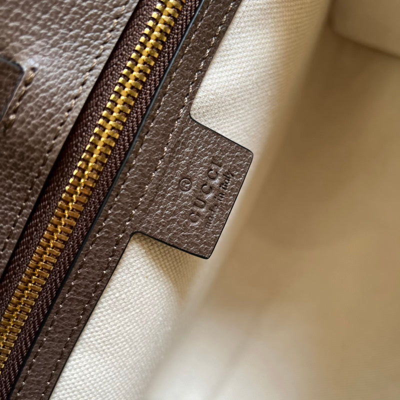 Side profile of elevated signature women's handbag – women's statement bag
