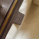 Side profile of elevated signature women's handbag – women's statement bag