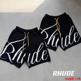 Close-up detail shot of Rhude luxury clothing with monogram-inspired silhouette