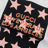 Side profile of Gucci luxury clothing with logo-detail design