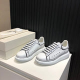 Alexander McQueen soft grey luxury sneakers view 11 chunky sole construction