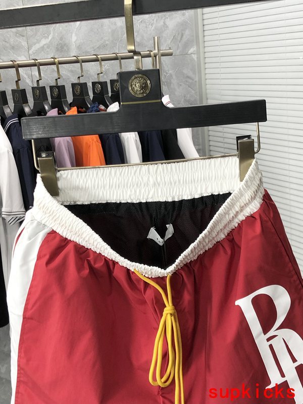 Close-up detail shot of Rhude luxury clothing with label-forward styling