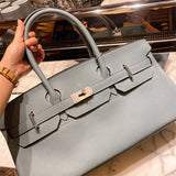  tailored top-handle bag detail view showing craftsmanship