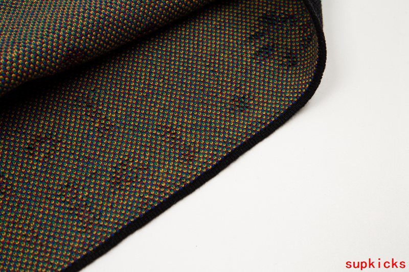 Close-up detail shot of Rhude luxury clothing with streetwear-inspired cut