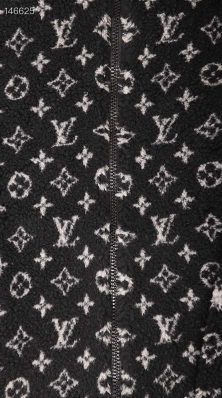 Flat lay presentation of Louis Vuitton luxury clothing with relaxed-fit cut