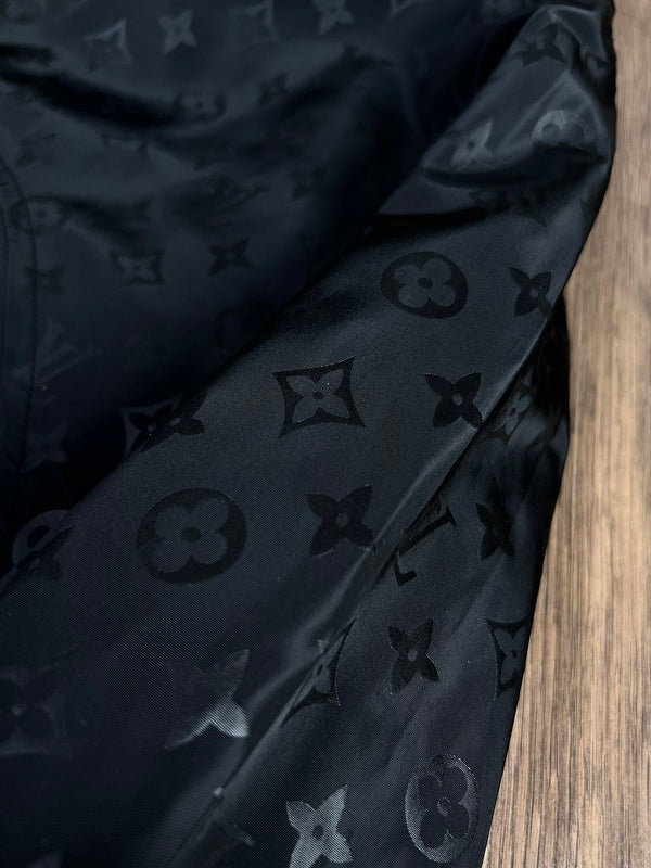 Flat lay presentation of Louis Vuitton luxury clothing with logo-detail design