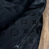 Flat lay presentation of Louis Vuitton luxury clothing with logo-detail design