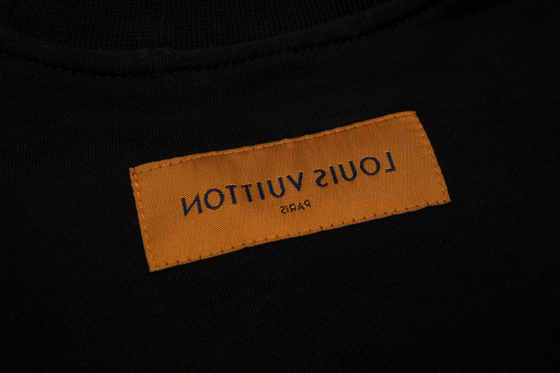Close-up detail shot of Louis Vuitton luxury clothing with signature branding