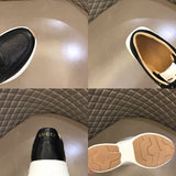 Side profile of Gucci all-black sneakers low-top design