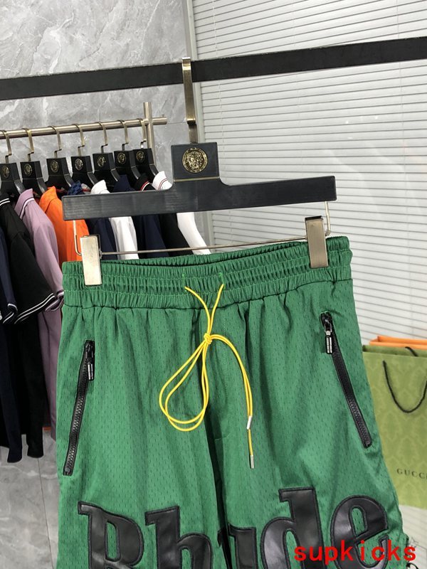 Close-up detail shot of Rhude luxury clothing with monogram-inspired silhouette