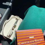 Side view of classic structured handbag