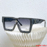 Close-up detail view of Louis Vuitton unisex sunglasses