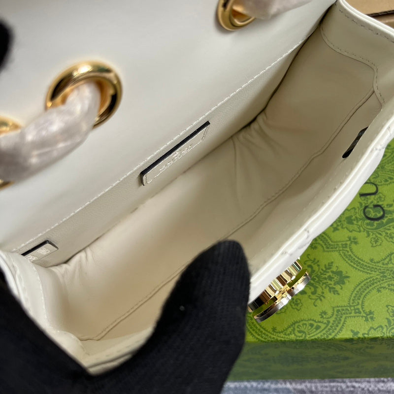 Styled lifestyle shot of classic polished women's handbag – women's statement bag