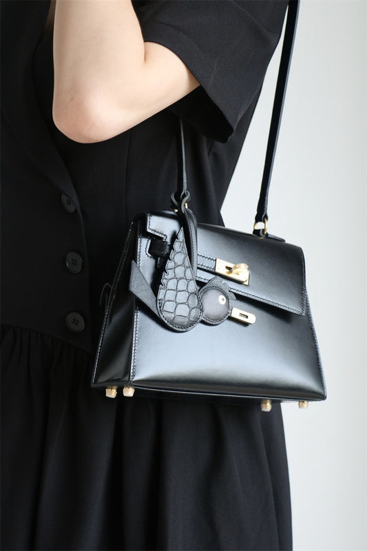 Side view of sculpted structured handbag