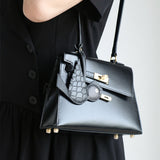 Side view of sculpted structured handbag