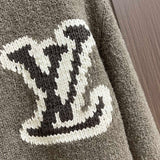 Flat lay presentation of Louis Vuitton luxury clothing with monogram-inspired silhouette