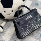  timeless top-handle bag styled with outfit