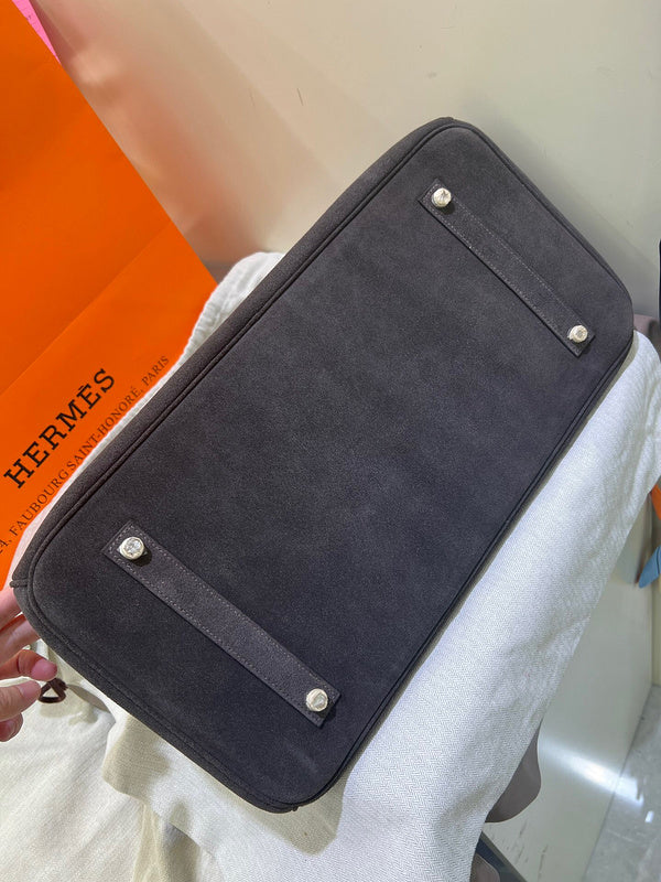 Side view of poised structured handbag