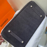 Side view of poised structured handbag