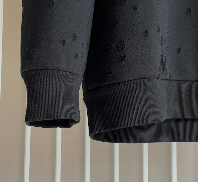 Texture and finish detail of Givenchy luxury piece style No.109