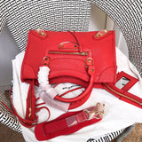 Styled lifestyle shot of statement polished women's handbag – women's designer-style accessory