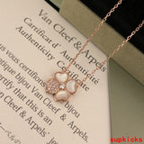 Lifestyle view of Van Cleef & Arpels unisex jewelry piece