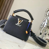 Front view of polished structured women's handbag – women's luxury accessory